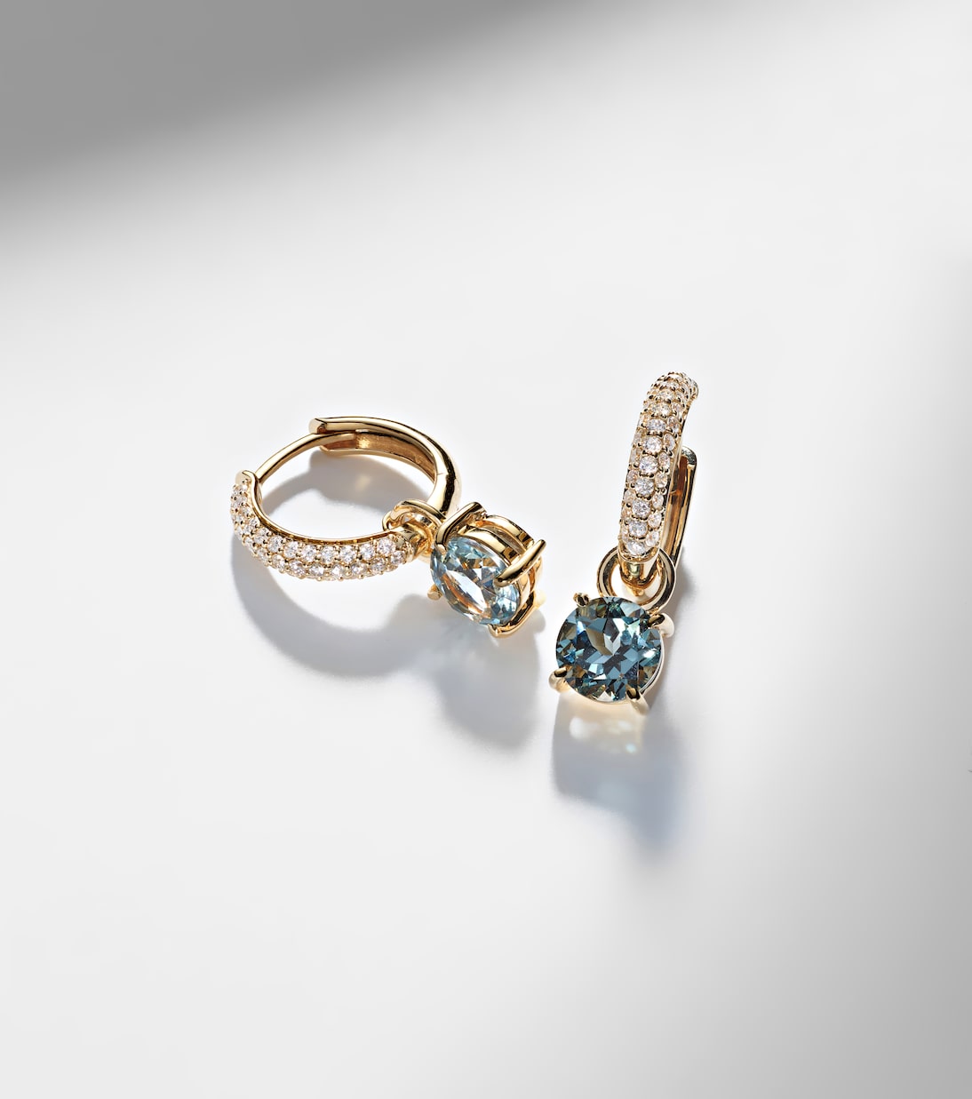 14kt gold huggie earrings with spinel and diamonds | Stone and Strand