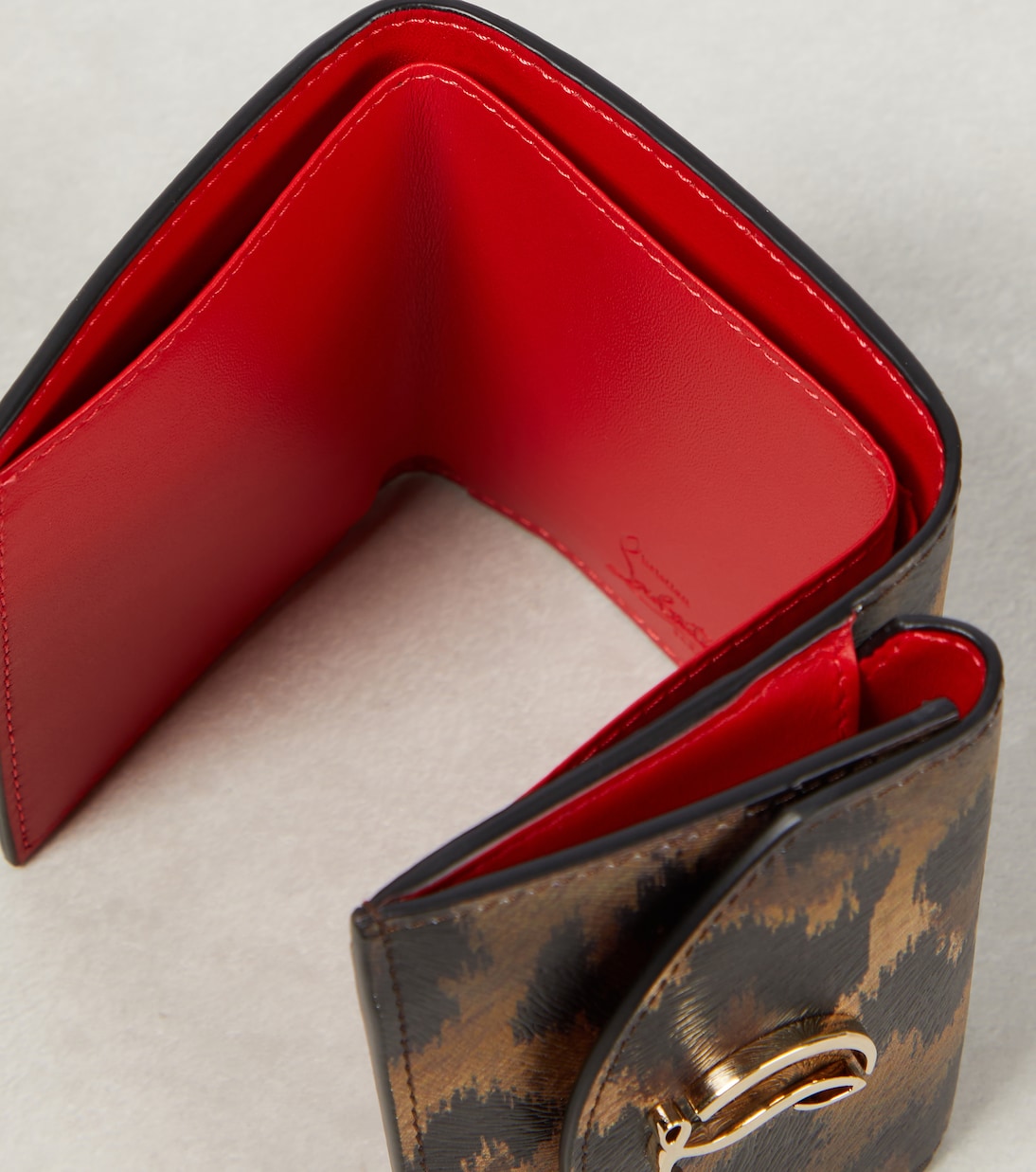 Portafoglio in pelle stampa leopardo con logo CL inciso, firma Christian Louboutin