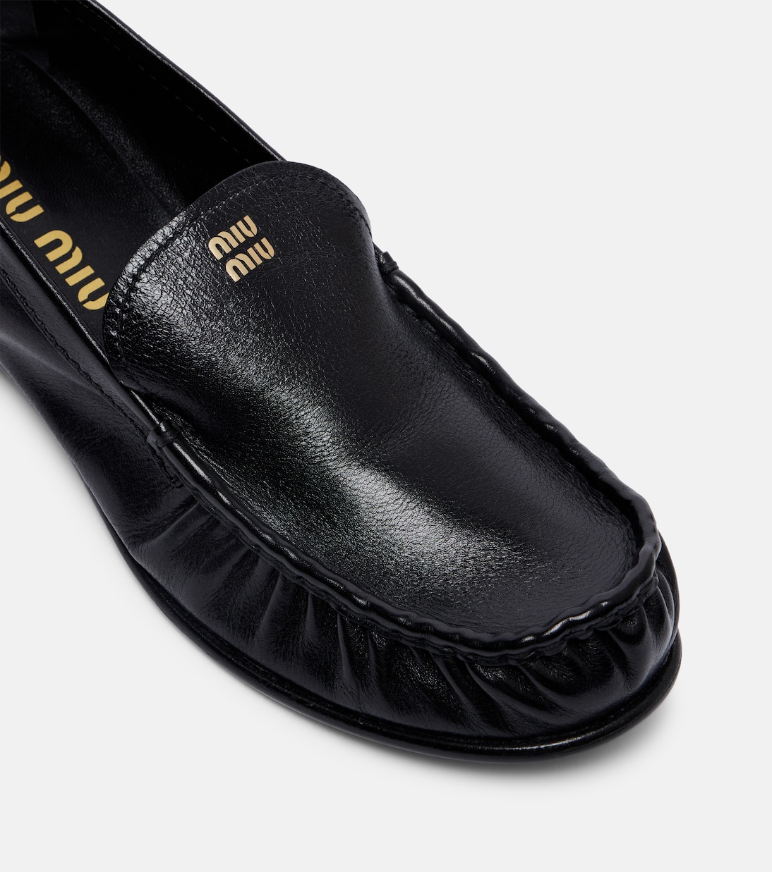 Mocassins en cuir à logo | Miu Miu