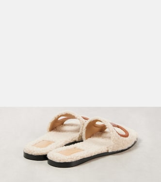 VLogo cutout faux shearling slides | Valentino Garavani