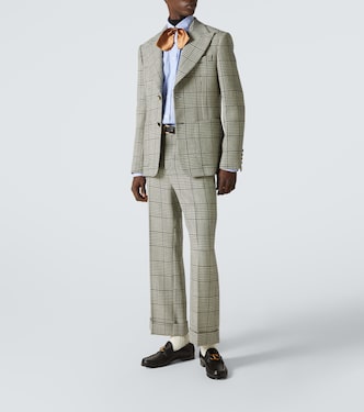 Houndstooth virgin wool flared pants | Valentino