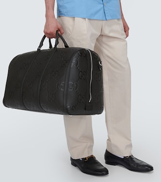 Sac de voyage GG en cuir embossé | Gucci