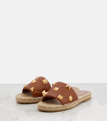 Roman Stud leather and raffia slides | Valentino Garavani