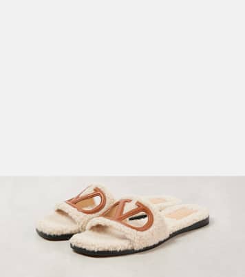 VLogo cutout faux shearling slides | Valentino Garavani