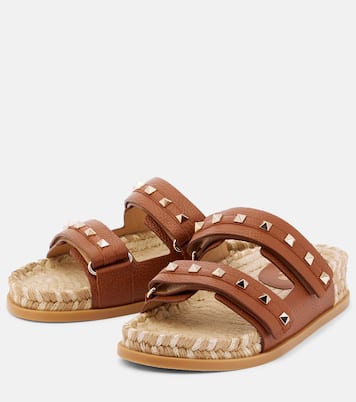 Rockstud leather and raffia slides | Valentino Garavani
