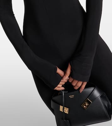 Mono flared con cuello alto | Norma Kamali