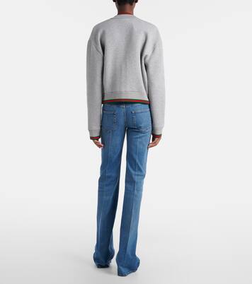 Jeans flared con efecto desgastado | Gucci