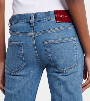 Jeans flared con efecto desgastado | Gucci