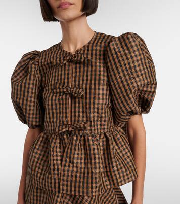 بلوزة بيبلوم بمربعات وتفاصيل فيونكة | Ganni