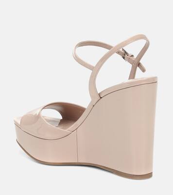 Patent leather wedge sandals in beige Prada Mytheresa