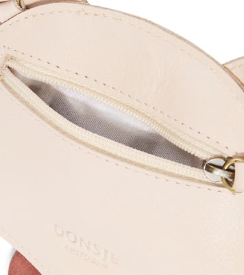 Pua pompom-trimmed metallic leather backpack | Donsje