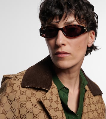 Occhiali da sole Interlocking G ovali | Gucci