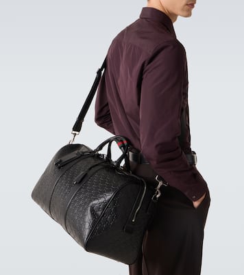 GG Emblem Medium leather duffel bag | Gucci
