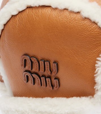 Shearling-trimmed leather hat | Miu Miu