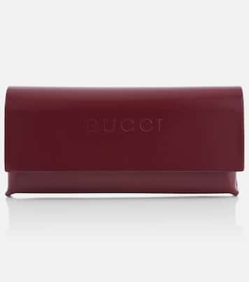 Logo embellished oval sunglasses | Gucci