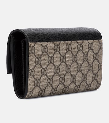 GG Marmont leather clutch in black Gucci Mytheresa