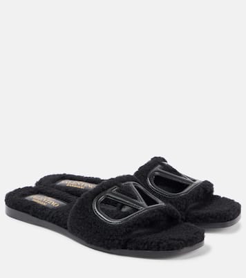 VLogo cutout faux shearling slides | Valentino Garavani