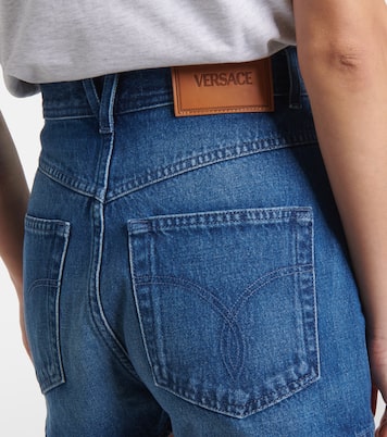 Shorts de denim con efecto desgastado | Versace