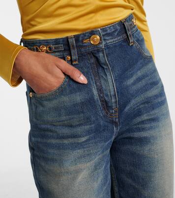 Jeans anchos de tiro alto con efecto desgastado | Versace