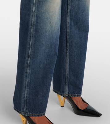 Jeans anchos de tiro alto con efecto desgastado | Versace